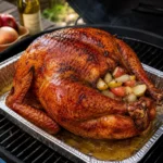 BBQ turkey served on a rustic wooden table with roasted turkey and smoky barbecue flavor
