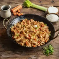 Crispy chicken fried rice with diced vegetables and tender chicken