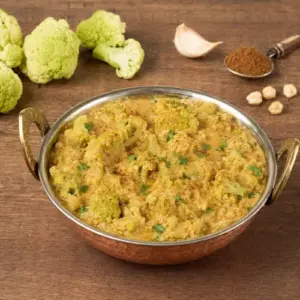 Green cauliflower masala with creamy tahini sauce, garam masala and fresh coriander