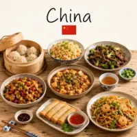 Chinese Recipes with dumplings noodles stir fry dishes and traditional Chinese specialties on a rustic wooden table