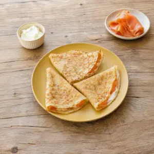 Savory air fryer pancake made with oat bran, wheat bran, eggs, cream cheese, and fresh herbs