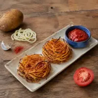 Spicy potato nests served with homemade tomato ketchup