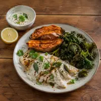 Flaky white fish with roasted sweet potatoes, crisp kale and creamy tahini-yogurt sauce.