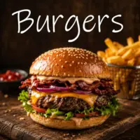 Juicy homemade cheeseburger with bacon, melted cheese, lettuce, tomato and onion, served with crispy fries on a rustic wooden table.